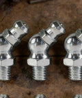Close-up of Pro Grade 10 Piece Metric Grease Fittings Kit With 90 Degree Elbows And Hydraulic Nipples for machinery use.