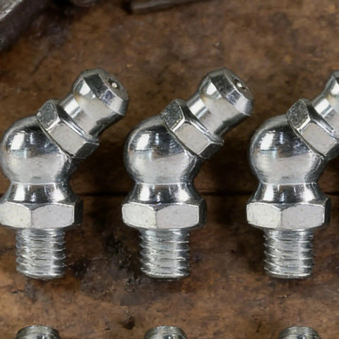 Close-up of Pro Grade 10 Piece Metric Grease Fittings Kit With 90 Degree Elbows And Hydraulic Nipples for machinery use.