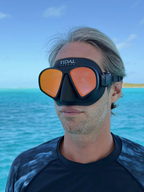 Aluma Pro Freedive Mask With Dope Anti Fog Technology, Ultra Low Volume For Freediving Snorkeling And Scuba worn by man near ocean.