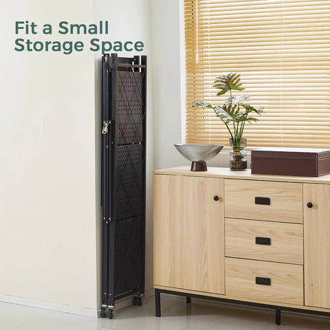 Nix The Clutter With This Game Changing Heavy Duty Folding Metal Organizer Shelf In Crisp White Featuring Three Tier Durable Wire Rack Versatile Display Stand And Multi Purpose Bookshelf For Home folded against wall in small storage space.