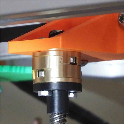 Upgrade Your 3D Printer Game With A Top Notch T8 Lead Screw Z-Axis Coupling For The Kee Pang VZBoT Printer. close-up of 16mm brass Oldham coupler on a 3D printer Z-axis lead screw