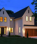 Outdoor Wall Light With Dusk To Dawn Sensor In Gold Weatherproof Exterior Wall Mount Sconce illuminating house facade