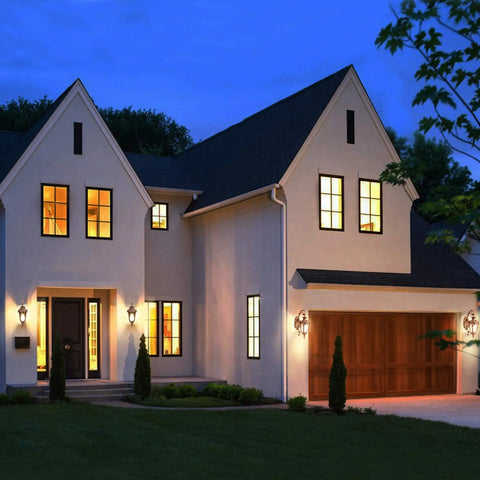 Outdoor Wall Light With Dusk To Dawn Sensor In Gold Weatherproof Exterior Wall Mount Sconce illuminating house facade