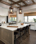 Rustic Farmhouse Pendant Lights Two Pack In Solid Oak And Matte Black Metal Cages With Long Adjustable Chains over kitchen island.