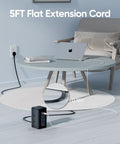 Sick Desk Organization Hack That Slaps With 230W Fast Charging Tower Featuring Eight Smart USB Ports For Laptops Phones And Tablets Vertical Power Strip on a table with a laptop.