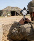 Soldier using Pro Grade Map Distance Meter delivering dead on accuracy for field surveys near army tent.