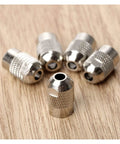Five Piece Copper Flexible Shaft Screw Top Collet Adapter Set For M8 X 0.75 Threads, showcasing metallic adapters on wood.