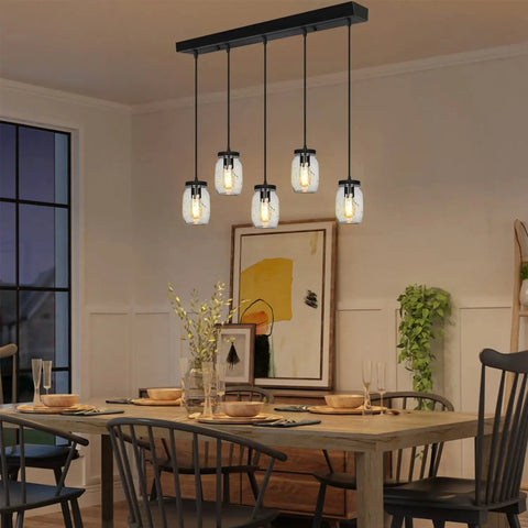 Five Light Glass Mason Jar Pendant Lights Farmhouse Kitchen Island Dining Room in rustic setting over dining table.