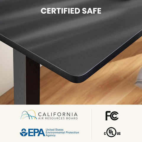 Close-up of L Shaped Standing Desk 63 By 55 Inches Electric Sit Stand Table With Adjustable Height showing black surface and certifications.