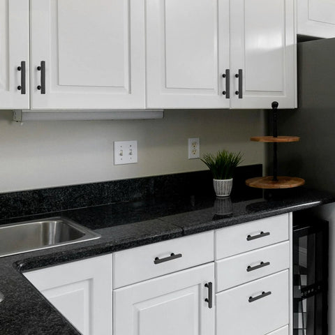 Modern kitchen with 10 Pack Matte Black 3 Inch Hole Center Cabinet Handles Stainless Steel Square Dresser Pulls on white cabinets.