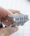 Hassle Free Rotating Date Stamp With Separate Black Ink Pad For Filing Invoices And Papers 12 Year Band Range close-up view of rotary date mechanism.