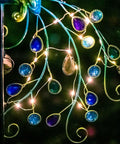 Metal Peacock Solar Garden Lights Stakes, Waterproof Path Lights for Outdoor Patio Lawn Yard Decor glow at night with LED lights.