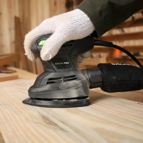 Detail Sander 1.7A 15000 OPM Compact Electric Sander in use on wood with handy dust bag, soft grip handle and GALAX PRO logo visible