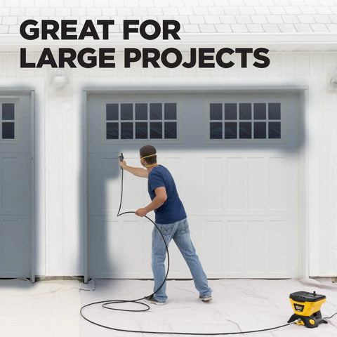No Fuss Heavy Duty Airless Paint And Stain Sprayer used on a garage door with a 25 ft hose for quick coverage.
