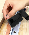 Hand adjusting Pro Grade T Track Stop Block Type 30 Aluminum Alloy Woodworking Limiter for precise positioning on workbench