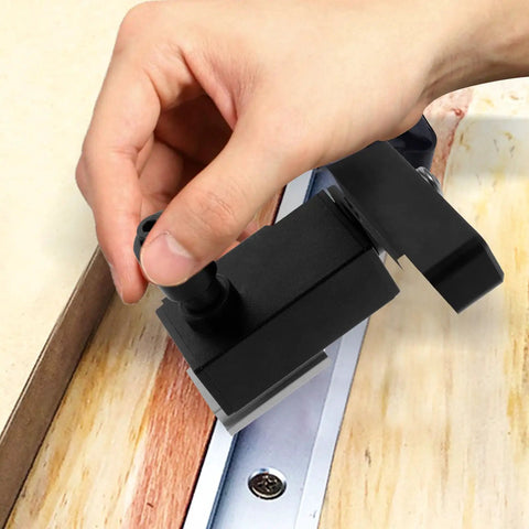 Hand adjusting Pro Grade T Track Stop Block Type 30 Aluminum Alloy Woodworking Limiter for precise positioning on workbench