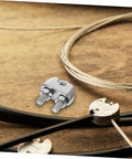 Heavy Duty Stainless Steel Wire Rope Cable Clamp U Bolt Fastener For 6mm Line with bolts on wooden background.