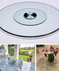 Big Glass Lazy Susan Rotating Turntable For Dining Table Display, Polished Edge Serving Tray With Non Slip Base, Heavy Duty Kitchen And Home Decor, Real Deal Performance To Kick Up Your Table Setup on a dining table.
