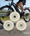 Three Beefy E Bike Motor Gear Set With Planetary Drive 36 Tooth Nylon Gears in front of a bicycle, showing bearings and circlips.