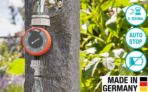 Easy To Use Mechanical Water Timer With Flow Control For Sprinklers And Drip Irrigation mounted on outdoor tap with garden background