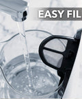 Water pouring into 1.5 Liter Glass Electric Kettle With Blue Led Glow Rapid Boil Auto Shutoff for easy filling.