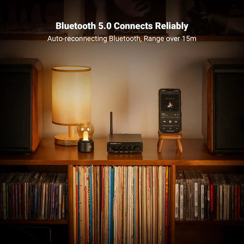 BT30D Pro Two Point One Channel Bluetooth Subwoofer Amplifier with TPA3255 chips on a wooden shelf with speakers.