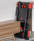 Heavy Duty Folding Flatbed Hand Truck Dolly For Moving Heavy Loads Portable Platform Cart With Easy Fold Storage Lightweight Durable Design For Home Garage Or Job Site Use folded beside cabinet
