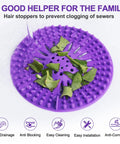 Heavy Duty Stainless Steel Hair Catcher For Shower Drain And Bathtub Tub With Solid Anchor Block upgraded drain strainer in purple catching debris.
