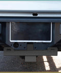 Rear view of mounted Beefy Winch Hitch Cradle Mount Plate with 2 Inch Receiver under vehicle bumper, black powder coated steel.