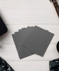 Guitar Fretboard Protector Kit With Metal Fretboard Guards And Sandpaper Sheets For Precision Smoothing And Safe Fret Maintenance And Repair Includes Durable Metal Shields And Fine Polishing Papers For Clean Edges And Pro Grade Guitar Care gray sandpaper sheets beside guitar neck