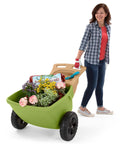 Easy Haul Wheelbarrow Green Garden Cart for Yard Work with wide wheel and durable steel frame, loaded with garden supplies.