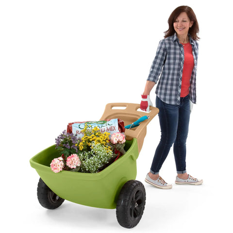 Easy Haul Wheelbarrow Green Garden Cart for Yard Work with wide wheel and durable steel frame, loaded with garden supplies.