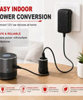 Rock Solid AC To DC 12 Volt Power Converter 24 Watt 2 Amp Adapter with plug connected to a tire inflator and a wall socket.