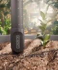 Detachable Stem Soil Sensor Probe For AI Controllers in garden soil, showcasing moisture and saturation monitor in grow space.