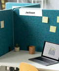 Set Of 10 Clear Cubicle Name Plate Holders For 2.25 Inch Wall Cubicle Signs displayed on blue fabric cubicle with a name insert.