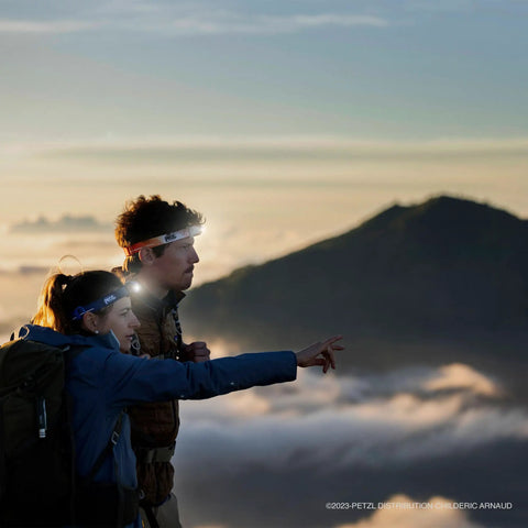 Hikers on a mountain at dawn using Core Rechargeable Battery For Hybrid Headlamps 1250 mAh Li Ion With USB Micro USB Port for lighting