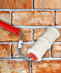 8 Inch Brick Pattern Embossing Paint Roller For Wall Decor DIY Easy Home Art Rubber Handle Embossing Cylinder For Creating Realistic Brick Wall Texture With Smooth Paint Finish, shown against brick background