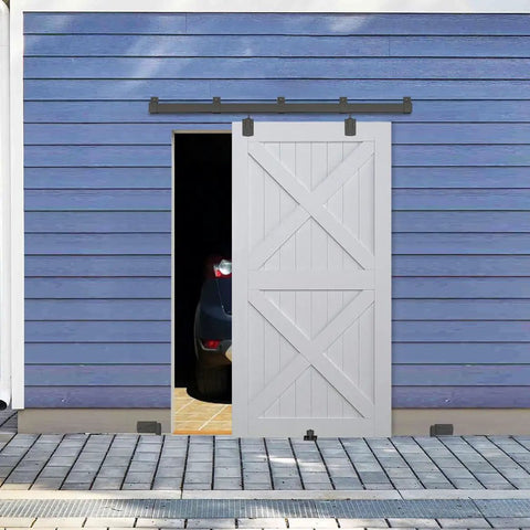 Heavy Duty Exterior Barn Door Hardware Kit 6 Ft Wall Mounted Slide Track Black finish on a rustic garage door.