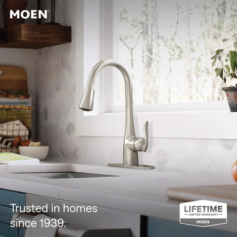 Top Shelf One Handle Pull Down Kitchen Faucet Featuring Power Boost Technology And Reflex Docking System In Spot Resist Stainless Finish installed in modern kitchen.