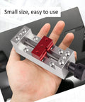 Person holding Beefy Pro Grade Mini CNC Router Vise Clamp With Right Angle Base, 65mm range, high precision hold down clamp