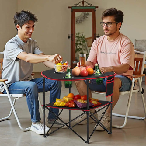 Two people sitting at Folding Camping Table For Outdoor Adventures Portable Lightweight Picnic Table With 66 Lb Capacity Waterproof 600D Oxford Fabric Four Cup Holders Carry Bag Tailgating Camping Beach Trips with snacks and drinks