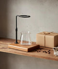 Premium Walnut Coffee Dripper Stand Adjustable Pour Over Holder with matte copper bracket and glass carafe on wooden shelf.