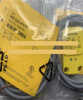 Proximity Switch Sensor NI25-Q20-AP6X2 in packaging, showing industrial grade non-contact sensor with wiring for automation systems.