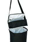 Insulated Baby Bottle Bag And Breastmilk Cooler Keeps Six Milk Bottles Chilled With Ice Pack Portable Two Compartment Leak Proof Feeding Sling For Parents On The Go in black with two compartments.