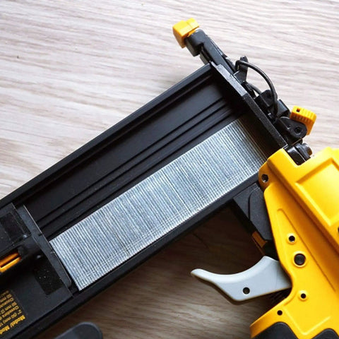 F50 nail gun loaded with Premium Grade 18 Gauge Brad Nails Two Inch Hot Dipped Galvanized Finish Heavy Duty Rust Proof Fasteners.