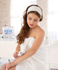 Woman using Six In One Hydrogen Oxygen Facial Device for salon and home use with interchangeable heads in spa setting.