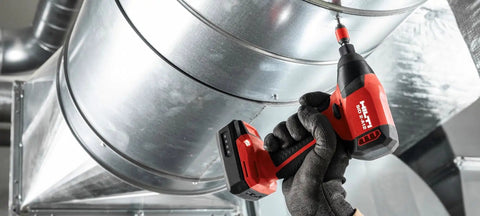 Worker using cordless drill with Battery Pack B 12/2.6 for Cordless Systems 10.8V Replacement Power Pack in industrial setting