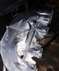 Fiberglass Heat Shield Tape with Aluminum Backing installed on a vehicle, offering a tough barrier against heat, chemicals, oil spills, dirt, and grime.