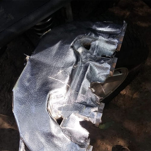 Fiberglass Heat Shield Tape with Aluminum Backing installed on a vehicle, offering a tough barrier against heat, chemicals, oil spills, dirt, and grime.