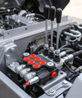 Heavy Duty Manual Hydraulic Directional Control Valve Block Featuring A Rock Solid Cast Iron Housing And Comfortable Lever Actuator For Tractor And Workshop Equipment That Handles Flow Like A Champ Built For The Long Haul - Close-up of control valve with levers.
